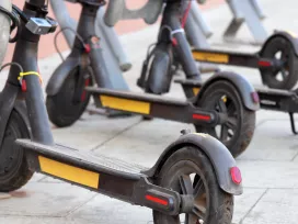A row of battery powered scooters.  Exponent provides electrical engineering support for consumer products.